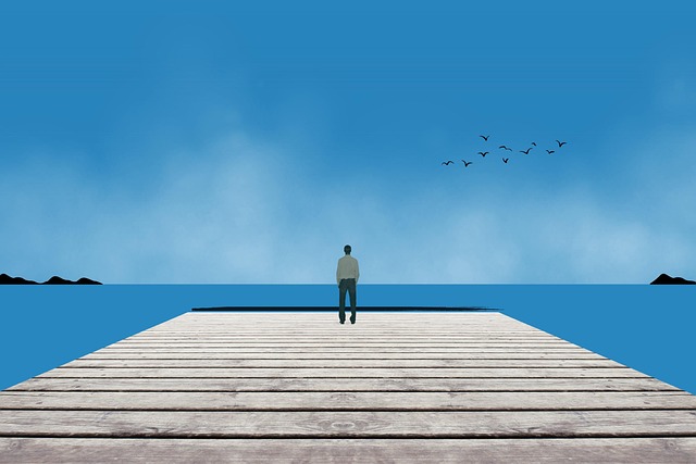 Einsamer Mann am Meer. Verlustangst und emotionale Abhängigkeit.